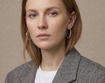 Wide stainless steel hoop earrings in silver and gold, 35 mm diameter