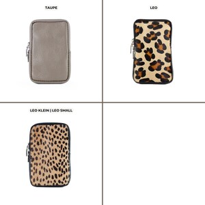 a set of four different animal print purses