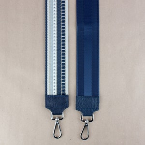 a pair of blue and white lanyard straps
