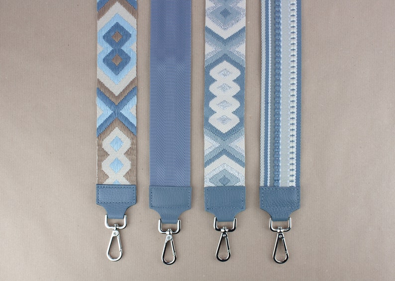 three lanyards with a blue and white design on them