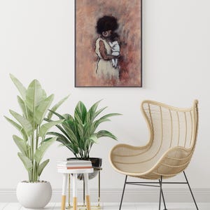 May include: An art print depicting a woman and child in a soft, muted colour palette of browns and creams. The framed artwork hangs on a white wall, complemented by potted plants, a small side table, and a woven chair. The overall aesthetic is calm and inviting.
