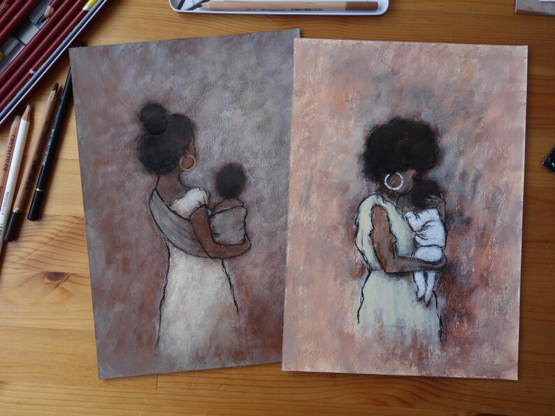 May include: Two pastel art prints depicting a mother and child. The figures are seen from behind, with the mothers in white dresses, cradling their children. The backgrounds are soft brown and pink.