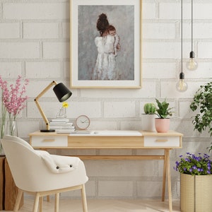 May include: A painting of a woman in a white dress holding a baby. The painting is framed in a light wood frame and is hanging on a white brick wall.