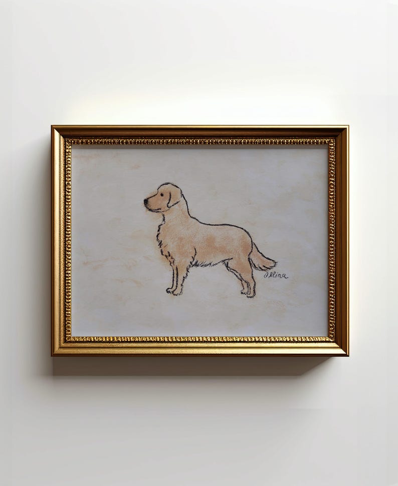 May include: A framed artwork featuring a sketch of a golden retriever dog. The dog is depicted in profile with a light brown coat and black outlines. The artwork is set against a light background and framed in a gold-colored frame.