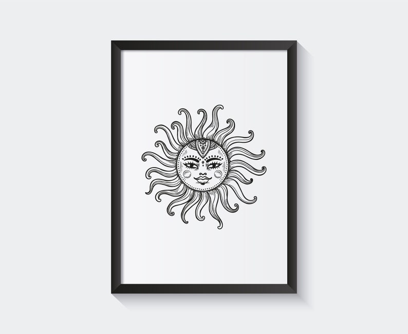 May include: Black and white line art print of a sun with a face in a black frame.