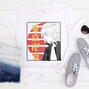 May include: White t-shirt with a graphic print of a character with blonde hair and a red and white background with Japanese text that says "Tokyo Revengers".