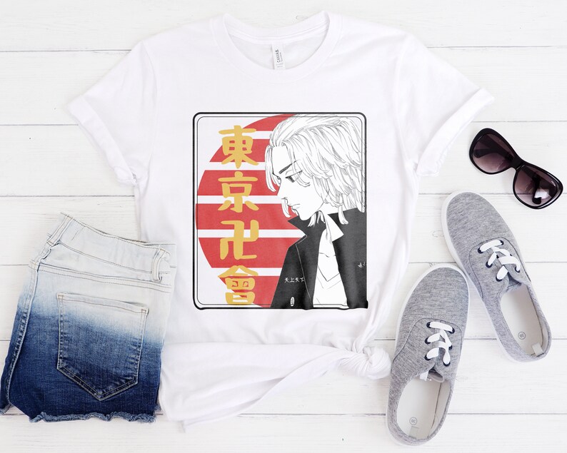 May include: White t-shirt with a graphic print of a character with blonde hair and a red and white background with Japanese text that says "Tokyo Revengers".