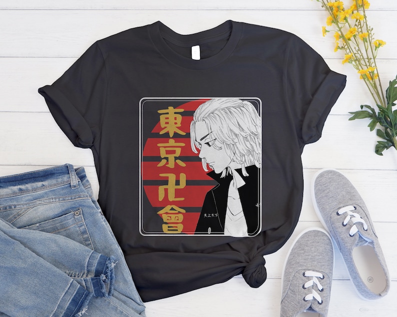 May include: Black t-shirt with a white graphic of a character with white hair and a black jacket. The graphic is set against a red and white background with the text "東京卍會" in Japanese.