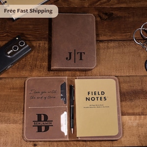May include: Brown leather journal with the initials "JT" embossed on the cover. The open journal reveals a "Field Notes" memo book, a pen, and the text "I love you until the end of time" and the name "Benjamin".
