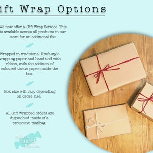 May include: Three brown gift boxes wrapped in Kraft paper with red and white ribbon. The boxes are on a wooden surface. The text on the image reads: "Gift Wrap Options" and includes details about the gift wrap service.