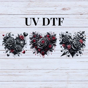 May include: Three gothic-themed designs featuring black roses and red accents. The designs include a heart with a skull, a heart filled with roses, and a floral arrangement with a dagger. The text "UV DTF" is displayed at the top.