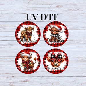 May include: Four round, red and black buffalo plaid patterned stickers with a cute cartoon Highland cow wearing a Santa hat and a scarf with Christmas lights. The text "Merry Christmas" is on one of the stickers.