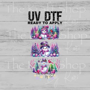 May include: UV DTF transfers featuring three snowman designs. Each design includes a snowman wearing a hat and scarf, surrounded by decorated trees, candles, and ornaments. The text "READY TO APPLY" is above the designs.