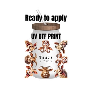 May include: A white glass jar with a wooden lid and a straw. The jar is decorated with cartoon goat faces and the text "CRAZY Goat Lady". The text "Ready to apply" and "UV DTF PRINT" are also visible.