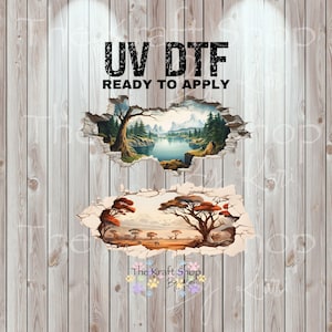 May include: UV DTF ready to apply transfers on a wooden background. The image features two landscape designs: a mountain lake scene and an African savanna scene. The Kraft Shop logo is at the bottom.