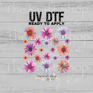 May include: UV DTF floral transfer sheet featuring a variety of colorful daisy designs. The text "UV DTF READY TO APPLY" is displayed in black. The Kraft Shop By Kari logo is at the bottom.