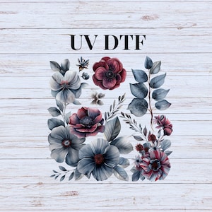 May include: A digital design featuring a bouquet of blue and burgundy flowers with green leaves. The design is labeled "UV DTF" and is suitable for use on apparel, home decor, and other crafts.