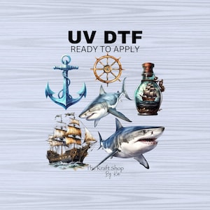 May include: A set of five nautical themed iron-on transfers for use with a heat press. The transfers include a ship, an anchor, a shark, a bottle with a ship inside, and a ship's wheel. The transfers are ready to apply. UV DTF READY TO APPLY. The Kraft Shop By Kai.