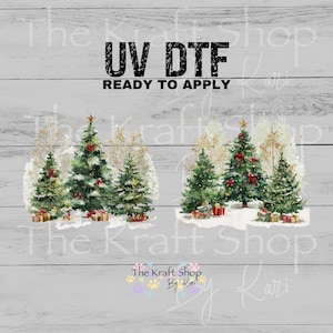 May include: UV DTF Christmas tree designs ready to apply. The image features two sets of Christmas trees with red bows, gold stars, and wrapped gifts. The text "UV DTF READY TO APPLY" is at the top. The Kraft Shop by Kari logo is at the bottom.