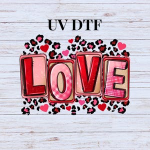 May include: A digital design featuring the word "LOVE" in red, pink, and white letters with a checkered pattern. The letters are surrounded by a leopard print pattern with pink hearts.