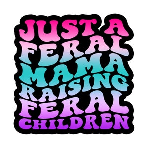 May include: A colorful graphic design with the text "Just a Feral Mama Raising Feral Children" in a rainbow gradient.