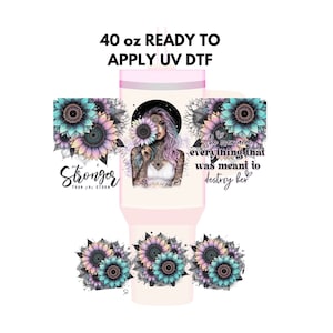May include: A 40 ounce ready to apply UV DTF design featuring a woman with pink hair holding a sunflower. The design also includes the text "Stronger Than The Storm" and "She overcame everything that was meant to destroy her".