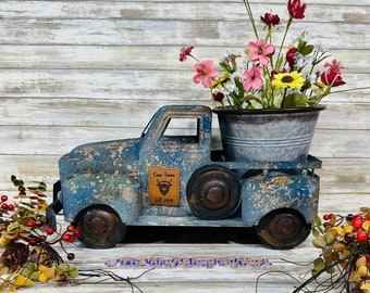 Personalized huge rustic farmhouse metal rusty truck with a personalized leather patch on the doors. Farm truck planter.