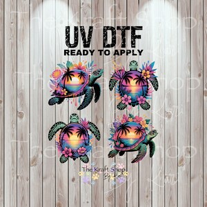 May include: UV DTF ready to apply transfers featuring four sea turtles with sunset scenes. Each turtle has a colorful sunset design with palm trees and flowers. The turtles are teal and black, set against a wood grain background.