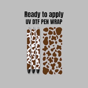May include: Ready to apply UV DTF pen wrap with a brown and white cow print design.