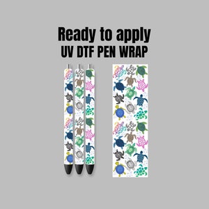 May include: Three pens with a white background and a pattern of colorful sea turtles. The text "Ready to apply UV DTF PEN WRAP" is at the top of the image.