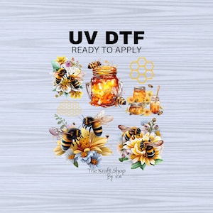 May include: UV DTF ready to apply, a digital transfer design featuring a honeycomb pattern, jars of honey, and bees with yellow and black stripes. The design is surrounded by yellow and white flowers.
