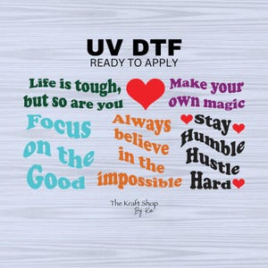 May include: UV DTF ready to apply graphic with motivational phrases like "Life is tough, but so are you" and "Make your own magic." Includes a red heart and the text "The Kraft Shop By Kei."