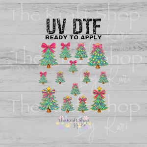 May include: A sheet of UV DTF transfers featuring colorful Christmas trees with pink bows and star toppers. The text "UV DTF READY TO APPLY" is printed at the top. The Kraft Shop By Kari logo is at the bottom.