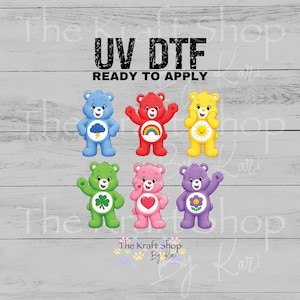 May include: UV DTF transfers featuring six colorful Care Bears. Each bear has a unique design, including a rainbow, a sun, a four-leaf clover, and a heart. The text "UV DTF READY TO APPLY" is at the top.