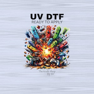 May include: A colorful explosion of video game controllers, with a bright orange and yellow center, against a white woodgrain background. The text "UV DTF READY TO APPLY" is at the top of the image. The text "The Kraft Shop By Kai" is at the bottom of the image.