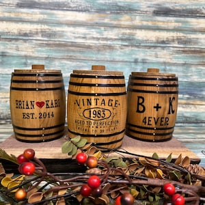 Personalized whiskey barrel decorations with handmade lids. These little rustic barrels are hand stained then personalized.
