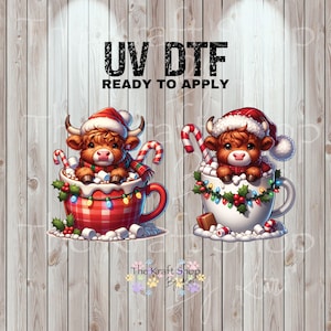 May include: Two festive designs featuring Highland cows in Christmas mugs. One mug is red plaid, the other white. Both cows wear Santa hats and scarves, surrounded by candy canes, lights, and marshmallows. The text "UV DTF READY TO APPLY" is at the top.