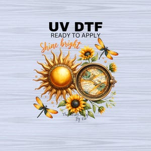 May include: A digital design featuring a sun with a compass, sunflowers, and dragonflies. The text "UV DTF Ready to Apply Shine bright" is included. The design is by The Kraft Shop By Kai.