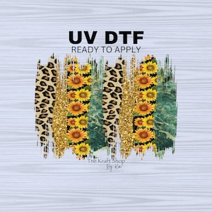 May include: A digital design featuring a layered pattern of leopard print, gold glitter, green marble, and sunflowers. The design is labeled "UV DTF Ready to Apply" and "The Kraft Shop By Kai".