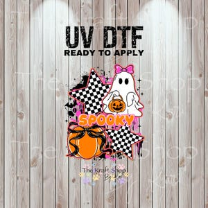 May include: A Halloween-themed design featuring a white ghost with a pink bow, holding a jack-o'-lantern, and an orange pumpkin with a black bow. The design includes the word "SPOOKY" and the text "UV DTF READY TO APPLY".