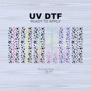 May include: A set of eight UV DTF transfer sheets with a leopard print pattern in various colors, including pink, yellow, blue, and green. The text "UV DTF READY TO APPLY" is printed at the top of the image. The text "The Kraft Shop By Kai" is printed at the bottom of the image.