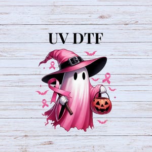 May include: A pink ghost wearing a witch hat and holding a jack-o-lantern. The ghost is holding a pink ribbon and the text "UV DTF" is above the ghost.