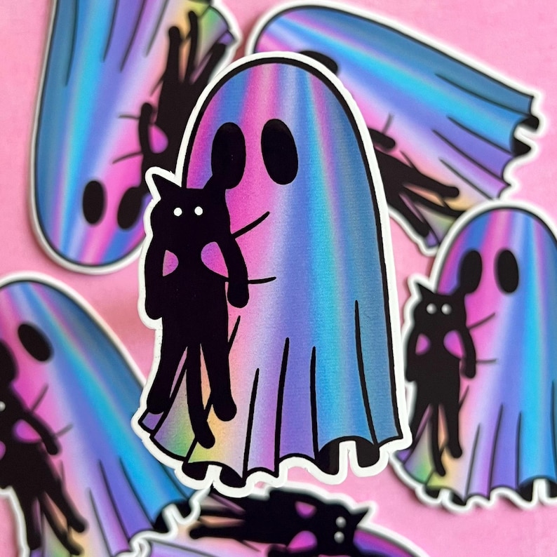 May include: A holographic sticker of a ghost holding a black cat. The ghost is a light blue, pink, and purple color. The cat is black with a white heart on its chest.