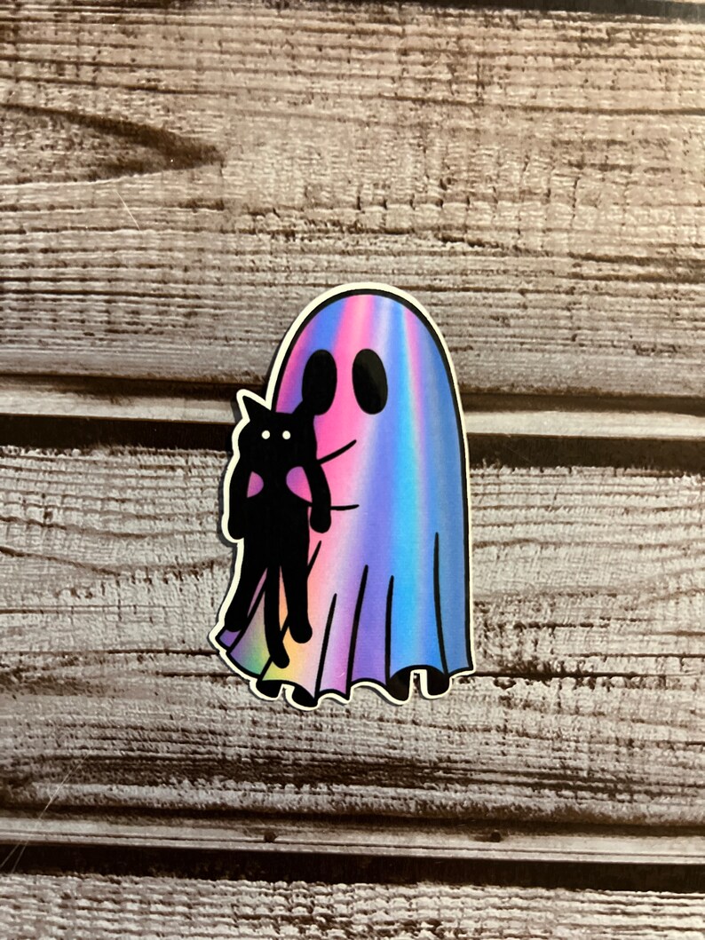 May include: A holographic sticker of a ghost holding a black cat. The ghost is a light blue, pink, and purple color.