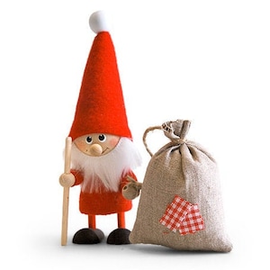 May include: A red felt gnome with a white beard holding a wooden stick and a small burlap sack with a red and white checkered design.