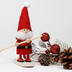 Santa on paddle board. Christmas ornament Santa gnome with string. Paddle board decor. Christmas tree ornaments. Paddle board gift