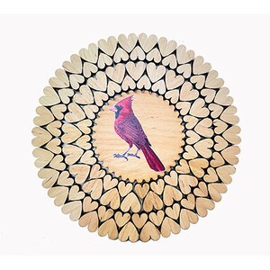 May include: A round wooden wall decor with a red cardinal bird painted in the center. The wood is made up of many small heart shapes.