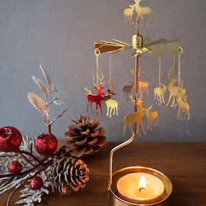 Candle holder. Spinning candle holders golden deer. Rotary candle holders. Candle holder. Candle carousel. Tea light holder. Candlestick