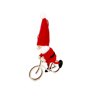 May include: A Christmas ornament featuring a Santa Claus figure riding a wooden bicycle. The Santa figure wears a red suit, a tall red hat, and a white beard. The bicycle is made of light-colored wood with black tires.
