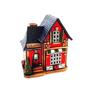 Toy shop. Ceramic candle house and aroma lamp in one. Candle holder. Candle holder house. Christmas village houses. Home decoration